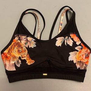 Naja strappy sports bra black with floral and tiger decal size Small